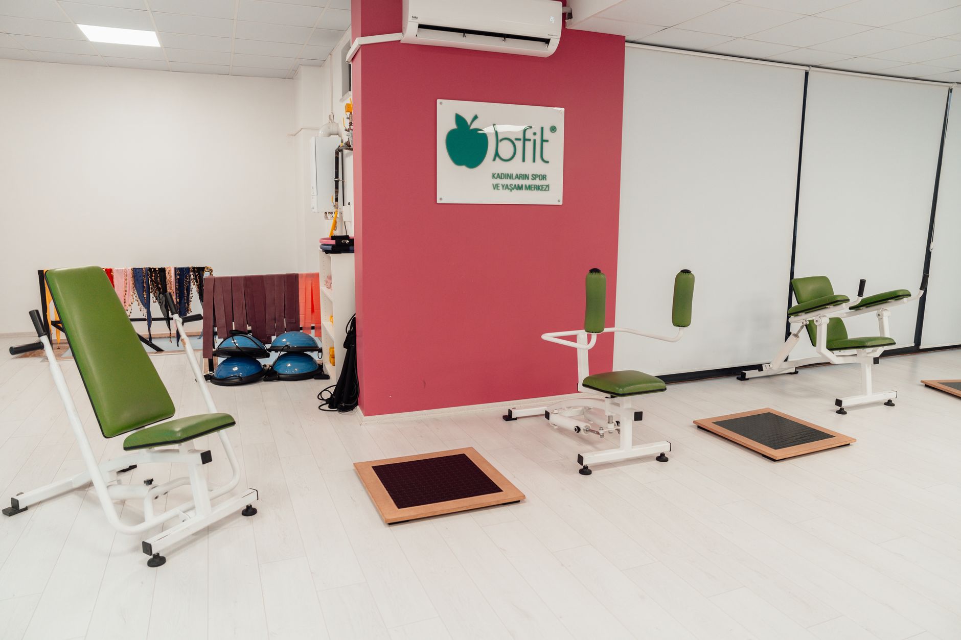 Training room with strength machines and floor plates
